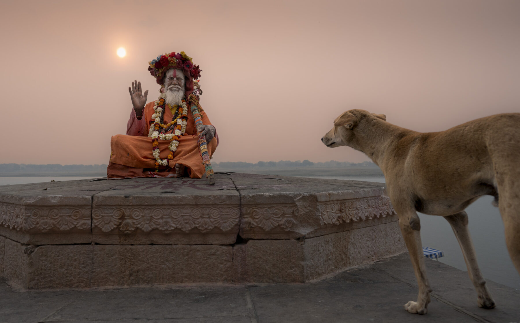 color photo of a Praying Sadhu along Ganges river by Sergio Volani