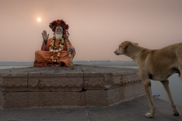 color photo of a Praying Sadhu along Ganges river by Sergio Volani