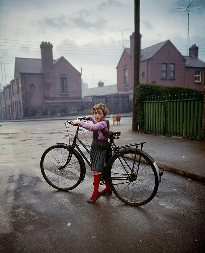 color photo of girl and bicycle by Evelyn Hofer