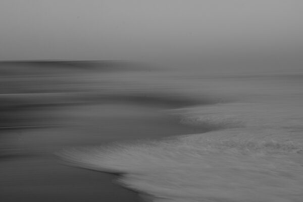 black and white abstract photo of the sea by Jos Van Dijk