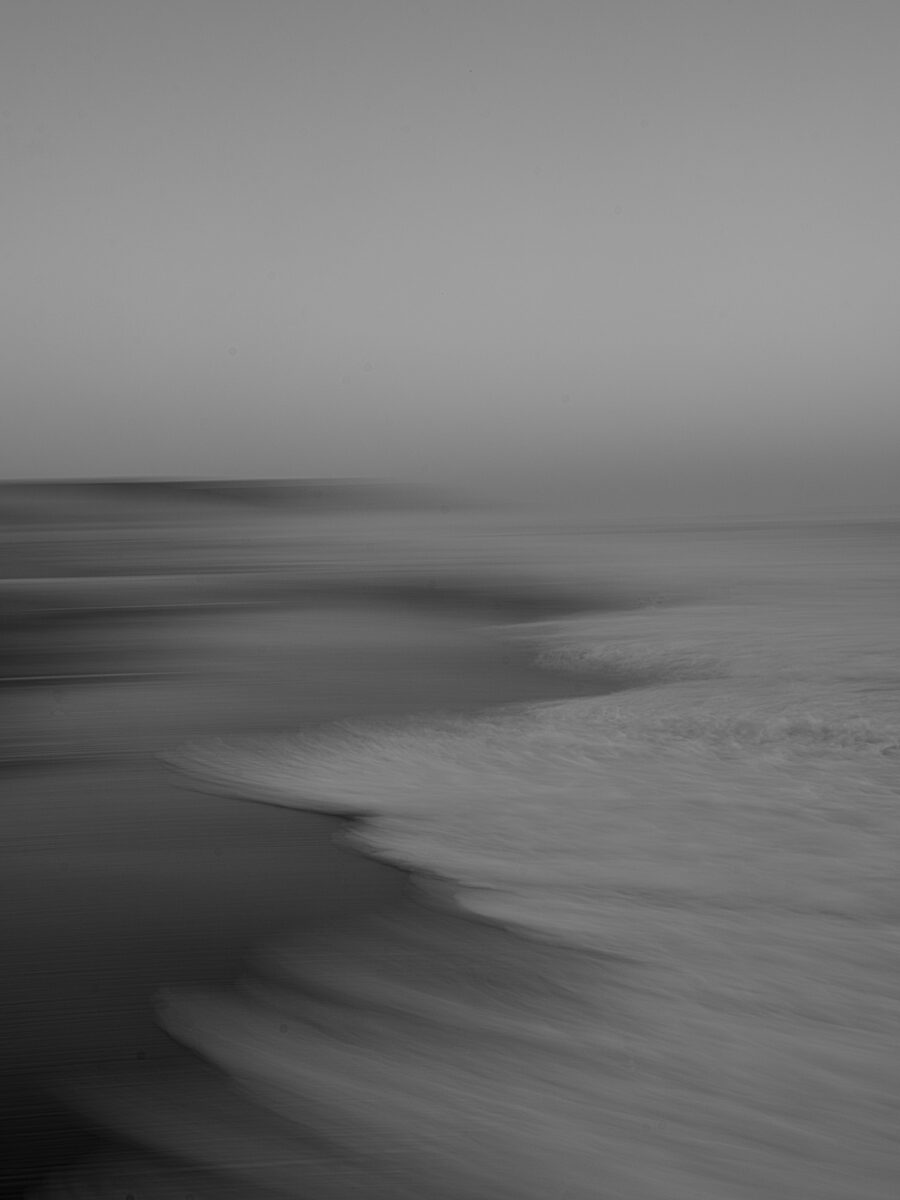 black and white abstract photo of the sea by Jos Van Dijk