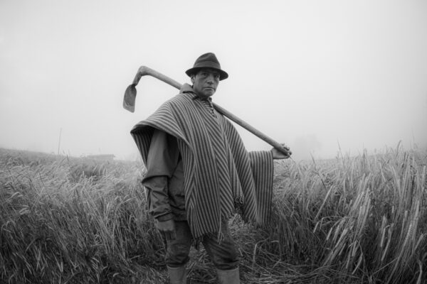 black and white portrait of man in field by Leo Bastidas Yar