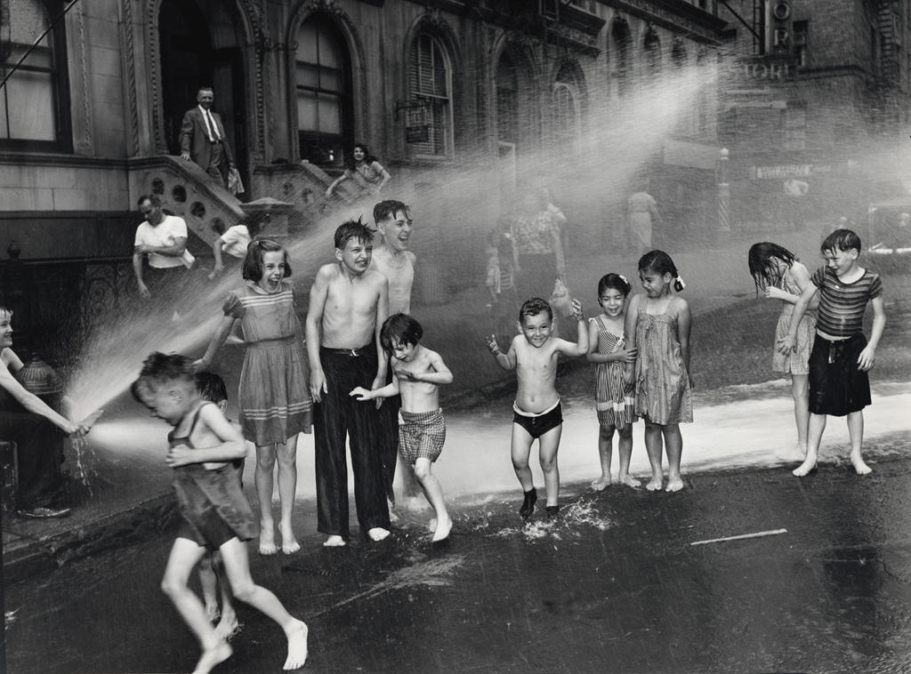 Black and white photo of boys playing by Weegee