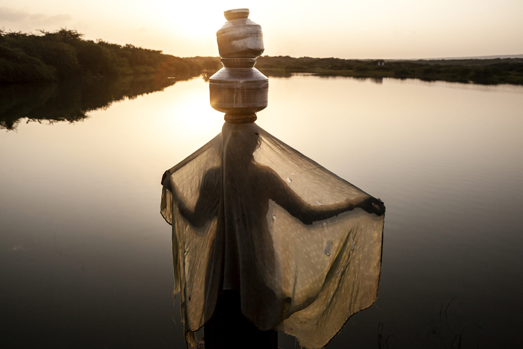 color photo of woman in sunset in Gujarat, India by Eliane Band