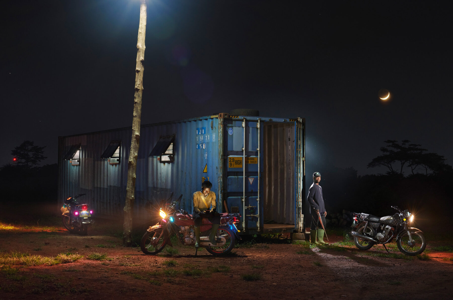 color street documentary photo of men on motorcycle in Ghana by George McLeod