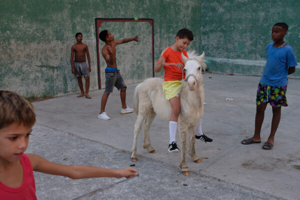 color street photo of children in Havana, Cuba by Alexandru Ilea