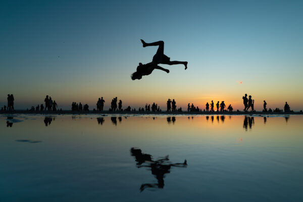 color photo reflection of man in sunset in Brazil by Dmytro Geshengorin