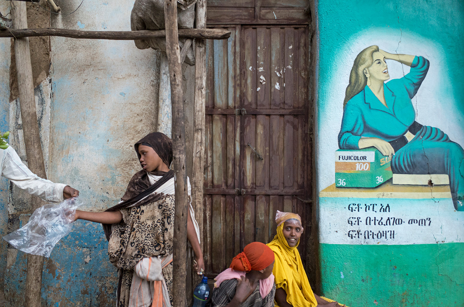 Candid street scene of people in the streets of Harar, Ethiopia, 2014 by Katerina Delta