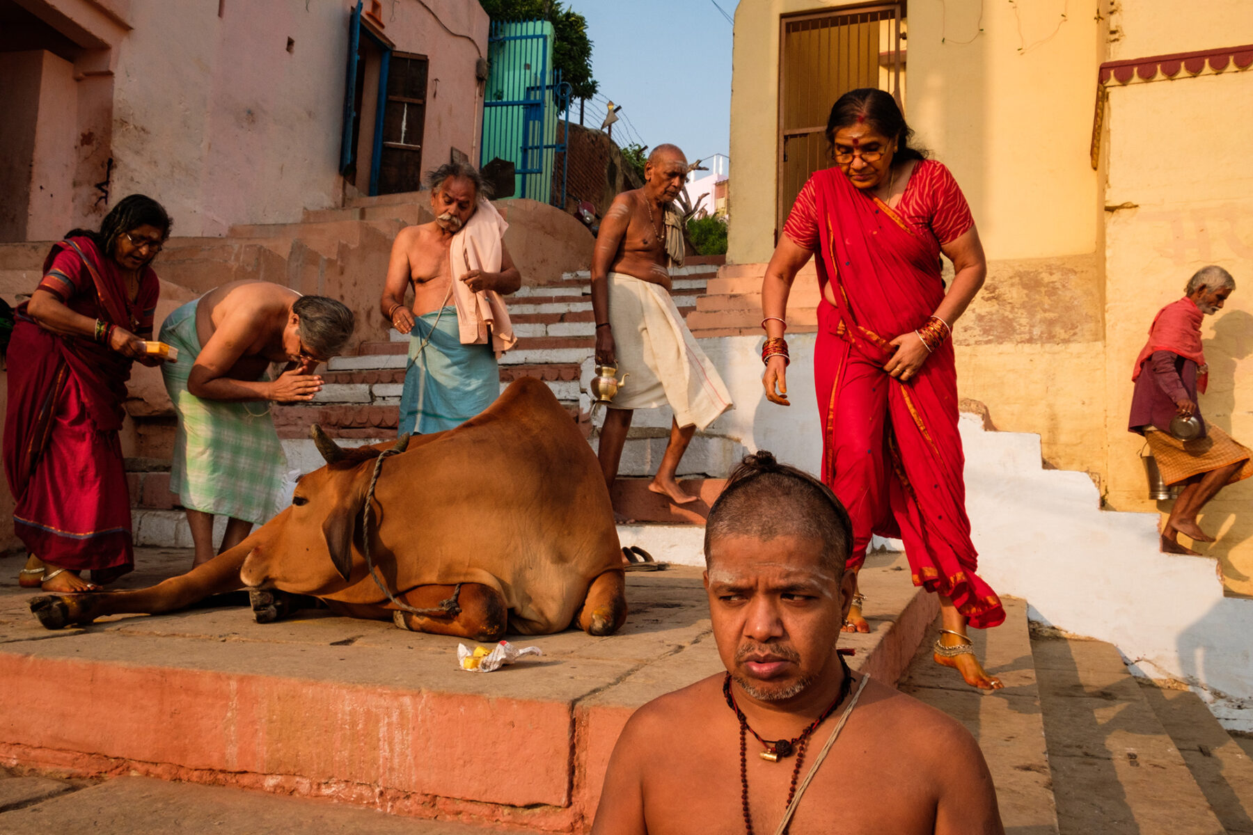 color street photo of people in Varanasi, India by Saumalya Ghosh