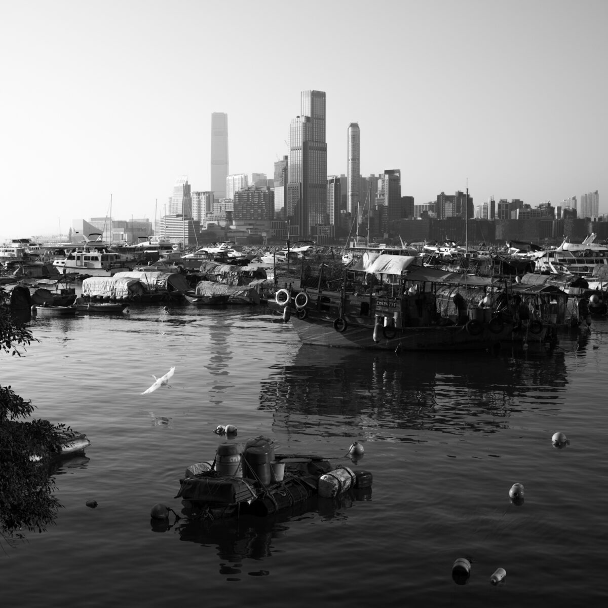 black and white landscape photo of Hong Kong by Wai Yin Poon