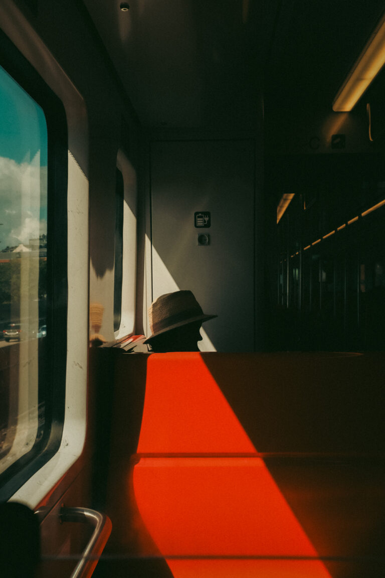 color street photography of man in train in Helsinki, Finland by Tommi Viitala