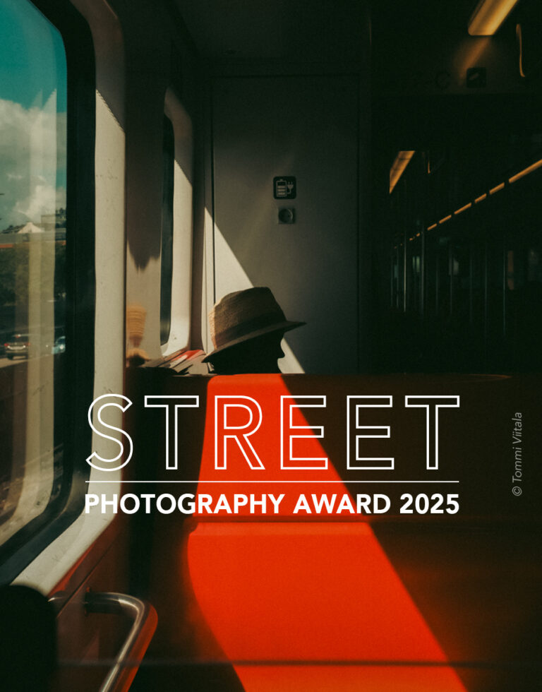 Color street photo of woman in train by Tommi Viitala