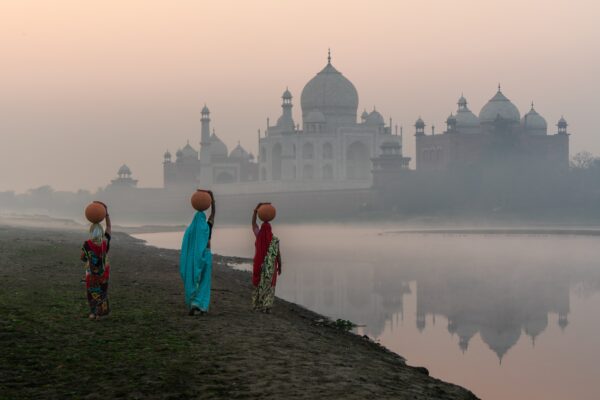 color photo of Water Bearers in Agra, India, by Erhan Coral